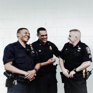 Spring Valley police officers share a moment of levity