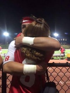 North Rockland Red Raiders QB Dylan Senatore hugs his mother following the team's crucial 28-20 victory over rival Suffern. The contest was close throughout but the Red Raiders held on to win in the end.  Photo by Janet Guerra 