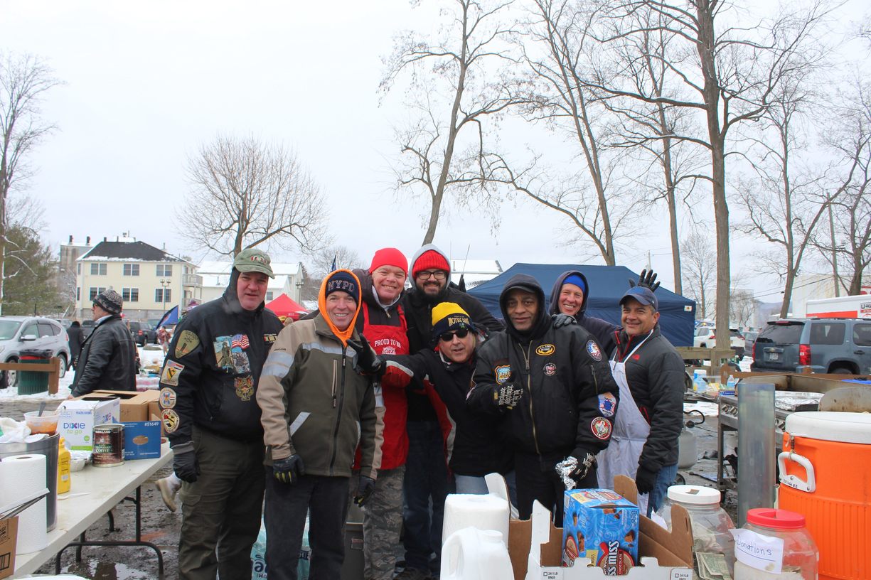 Picture of The Immaculate Conception Men's Club happy to serve other local residents food and beverages at the event.