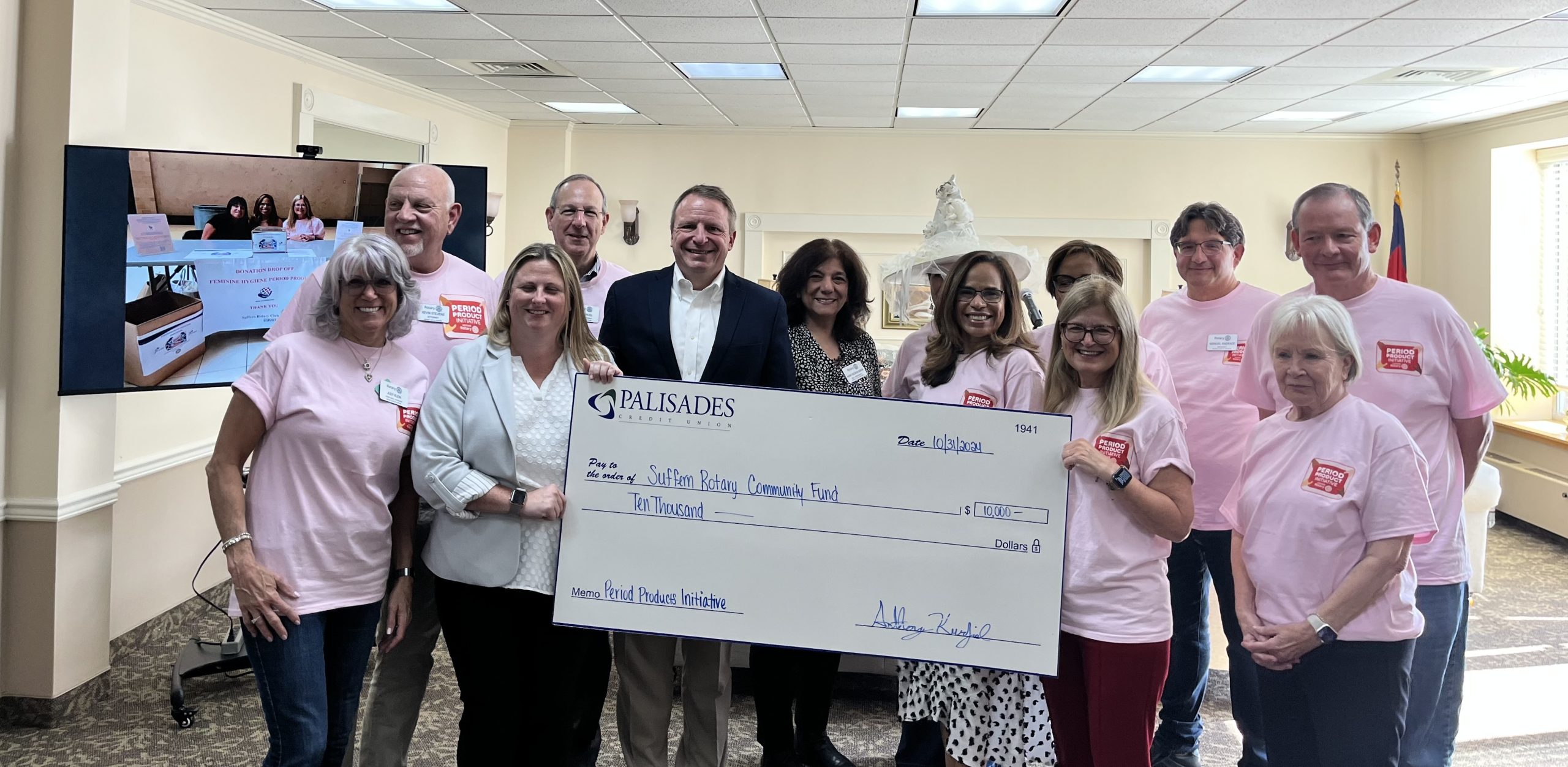 Members of the Suffern Rotary Club and the Palisades Credit Union posed for a picture as they celebrated the donation. 